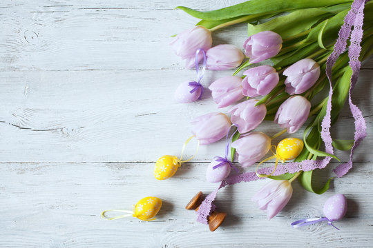 Easter background with tulips and decorative eggs