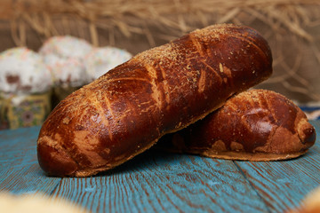 Russian homemade pie, loaf cake with nuts on rustic wooden table background, close-up. Delicious russian national dessert sweet pastry