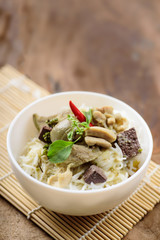 Thai food, rice noodles with green curry chicken (Kanom Jeen Kang Keaw Wan Gai)