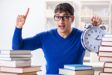 Male student preparing for exams in college library