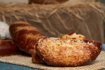 Russian homemade pie, loaf cake with nuts on rustic wooden table background, close-up. Delicious russian national dessert sweet pastry
