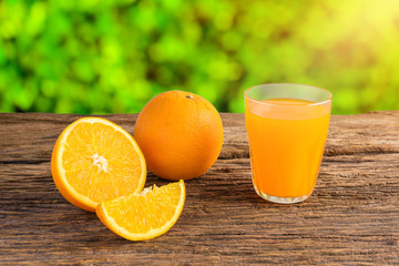 Glass of Fresh Orange Juice on grunge wooden table