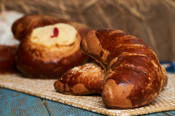 Russian homemade pie, loaf cake with nuts on rustic wooden table background, close-up. Delicious russian national dessert sweet pastry