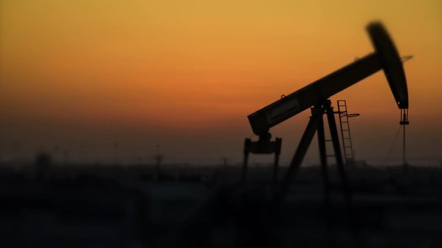 Oil Pump Timelapse at Sunset - Defocused background