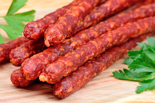 Group of smoked sausages on table