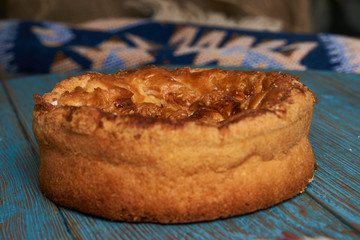 Traditional slavic russian and ukranian festivals and weddings bread Round Loaf Karavai pastry on wooden rustic table 