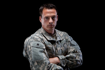 Fototapeta premium Army Soldier With His Arms Crossed Looking Serious