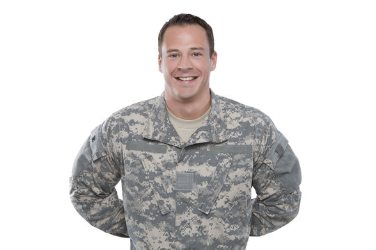 U.S. Army Soldier, Sergeant. Isolated, smiling and parade rest.