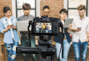 Professional digital Mirrorless camera recording video blog of Group Of Asian and Multiethnic Business people using social network , Camera for photographer or Video and Live Streaming concept