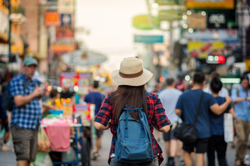 Back side of Young Asian traveling women walking and looking in Khaosan Road walking street in...