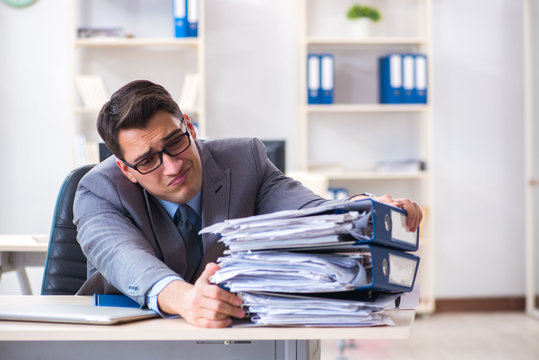 Overloaded with work employee under paperwork burden