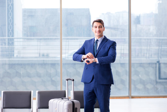 Businessman waiting at the airport for his plane in business cla
