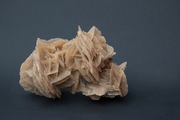 Desert rose, a flowerlike aggregate of crystals of a mineral occurring in arid areas, isolated on...