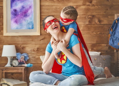 Girl and mom in Superhero costume