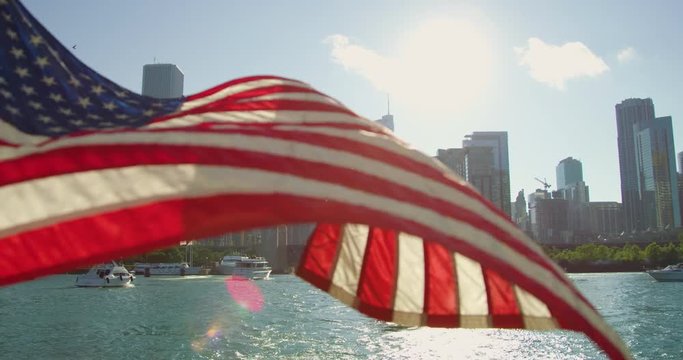 Boats with tourists and a waving flag
