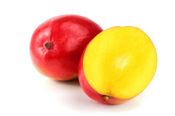 Mango fruit and half isolated on white background close-up