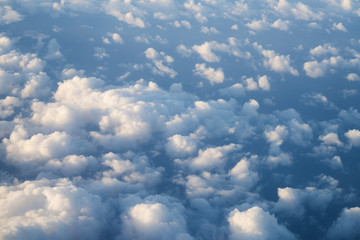 flying above the clouds in midday