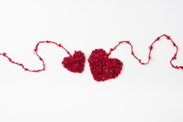 wool weaved red heart with line isolated on white background for romantic valentines day design concept