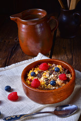 rustic muesli breakfast with forest fruits
