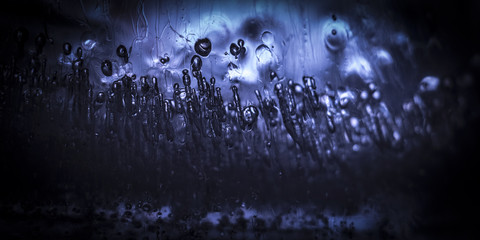 Bubbles of air frozen inside the ice close up.