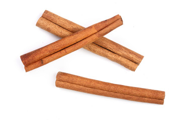 Cinnamon sticks isolated on white background. Top view