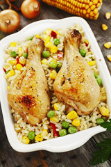 Chicken legs baked with rice and vegetables