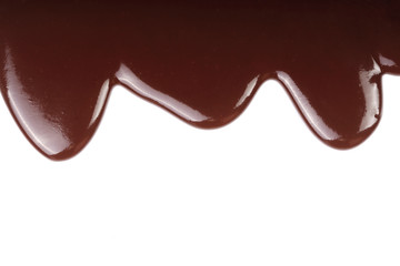 Melted chocolate dripping isolated on white background