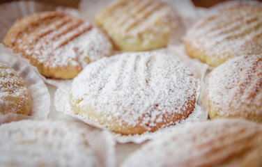 Homemade or table food cookies on white plate with burlap textile. Close up shot.