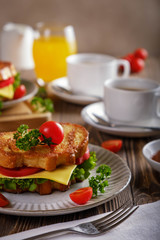 Sandwich of croutons with coffee and orange juice.