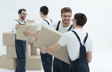 Portrait of movers holding box smiling isolated on white backgro