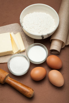 Vertical baking ingredients for Easter cake background.