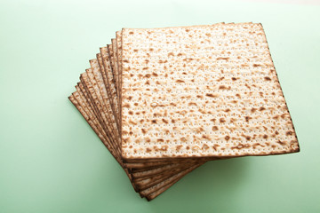 passover matzoh bread on green studio background