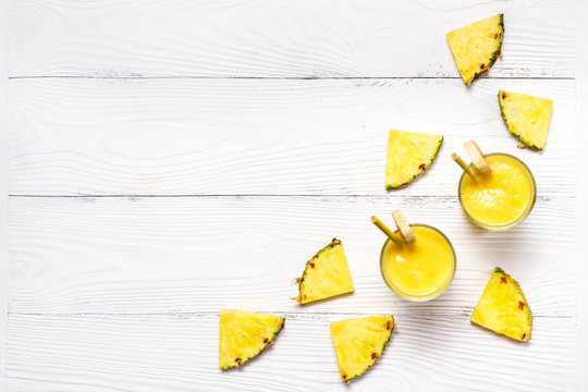 Yellow Pineapple Smoothie With Ingredients On White Wooden Background With Copyspace