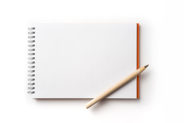 Design concept - Top view of orange spiral notebook and wooden ballpoint pen isolated on white background for mockup