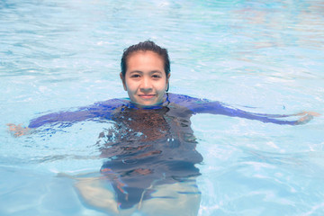 Asian woman swimming pool