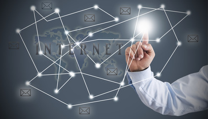 Businessman presses with finger on the structure of the network. network concept