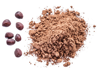 Carob beans and carob powder on the white background.
