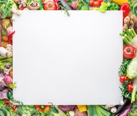 Different colorful vegetables arranged as a frame on white background.
