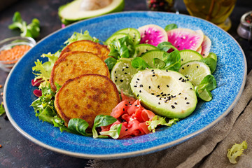 Vegan buddha bowl dinner food table. Healthy food. Healthy vegan lunch bowl. Fritter with lentils and radish, avocado salad