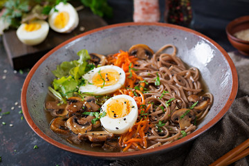 Japanese miso ramen noodles with eggs, carrot and mushrooms. Soup delicious food.