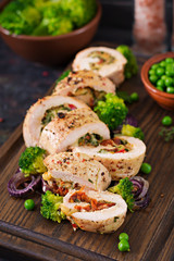 Chicken roll with stuffed sun-dried tomatoes and cheese.