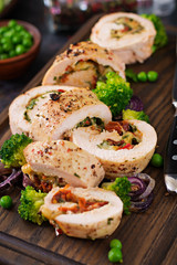 Chicken roll with stuffed sun-dried tomatoes and cheese.