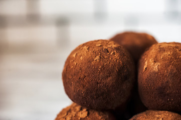 Beautiful round chocolate candy close-up. A round chocolate cake looks like a planet. Tasty, healthy, healthy food