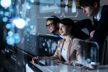 Group of people looking at the futuristic user interface.