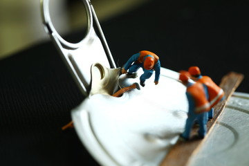 Miniature figure model on aluminum lid scene.