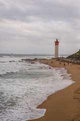 Fototapeta premium Beach with Lighthouse in Background