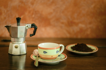 cup of coffee with mocha, powder and container jar