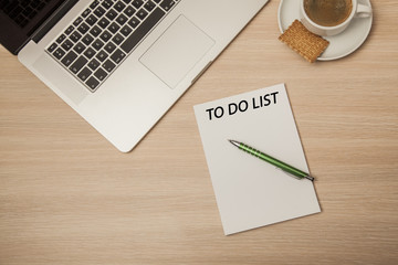 an empty notebook on a corporate desk, to do list and coffee 