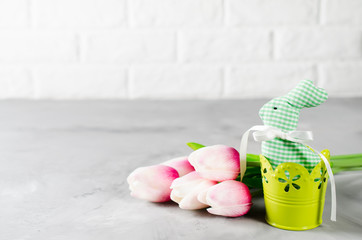 Easter composition with bunny, eggs and tulips.