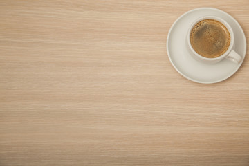 coffee on the wooden office desk, top view 